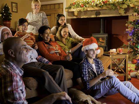 A family watching a movie together during a past festive season, holiday.