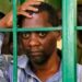 A photo of Pastor Paul Mackenzie behind bars in Kilifi County.