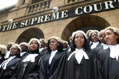 Law graduates post for a photo outside Supreme Court of Kenya