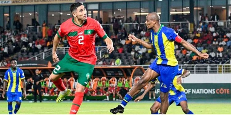 Morocco's defender Achraf Hakimi (L) fights for the ball with Tanzania's midfielder Himid Mao during the Africa Cup of Nations 2024 group F football match between Morocco and Tanzania at Stade Laurent Pokou in San Pedro, Ivory Coast on January 17, 2024.