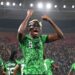 Nigeria Striker, Victor Osimhen wearing a face mask celebrating a 2-0 win against Cameroon.