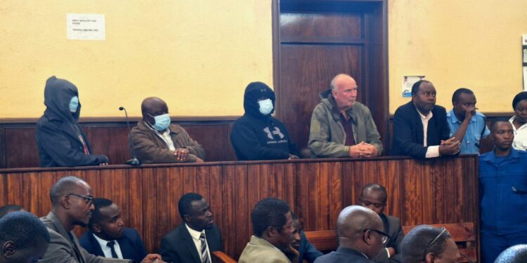 A photo of the four persons arraigned in court in connection with forgery allegations in the Nakuru War Memorial Hospital land dispute.