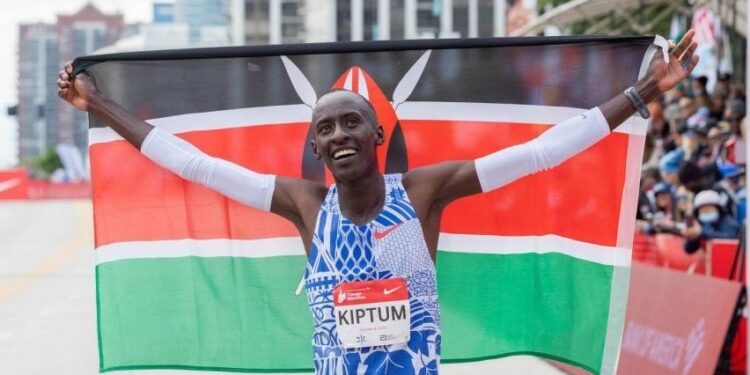 Kelvin Kiptum celebrates after winning the Chicago Marathon in 2023.