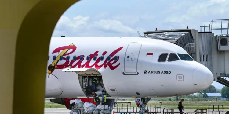 A Batik Air passenger plane with pilots at Sultan Iskandar Muda International Airport in Indonesia in 2022.