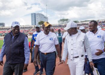 Sports Cabinet Secretary Ababu Namwamba (second from right) and President William Ruto (center0 arrive at the Nyayo Stadium on March 24, 2024.