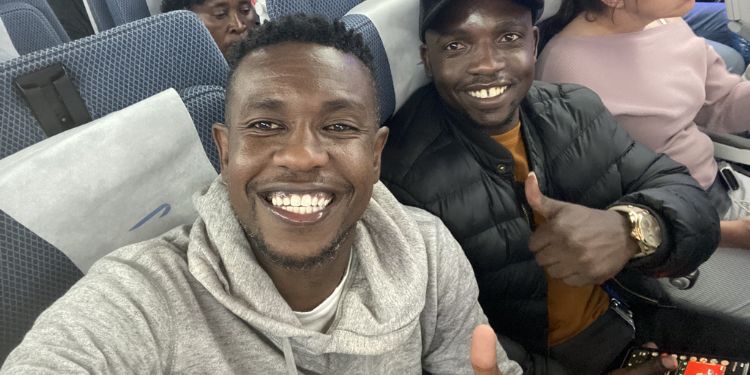 Guinness' Matchday Committee, Chief Entertainment Officer, Lotan Salapei and , Christopher Omungala inside a plane enroute to London. 
