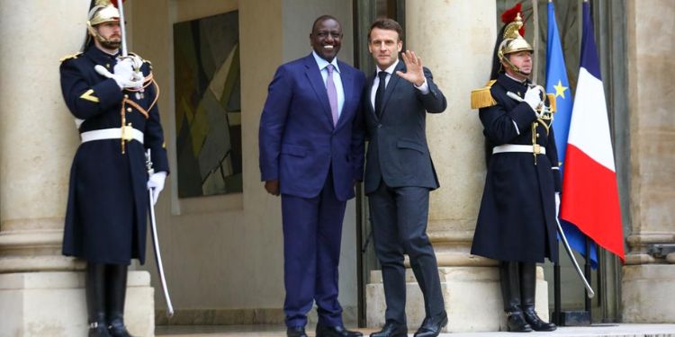 President William Ruto (left) poses for a photo with French President Emmanuel Macron ion a past meeting.