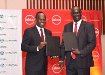 Absa Bank Kenya MD & CEO Abdi Mohamed and Old Mutual East Africa Group CEO Arthur Oginga officially launch the Linda Biz SME bundled insurance solution. PHOTO/ ABSA