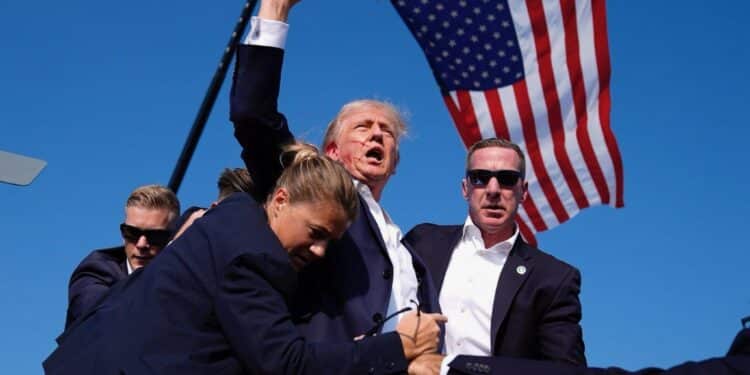Former U.S President Donald Trump helped by Secret Service after he was shot on Saturday, July 13, 2024. PHOTO/Courtesy.