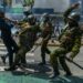 Kenyan police officers manhandle a protestor on June 25, 2024. Gerald Anderson/Anadolu via Getty Images